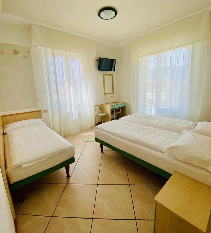 Postel nebo postele na pokoji v ubytování Hotel Ideal