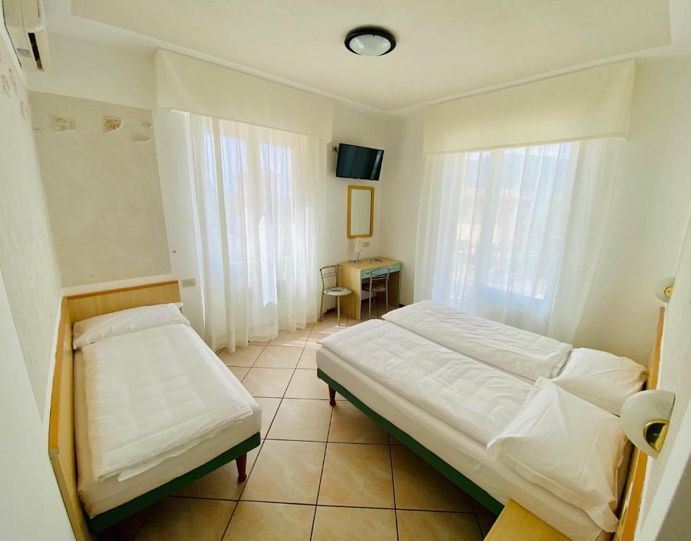 Postel nebo postele na pokoji v ubytování Hotel Ideal