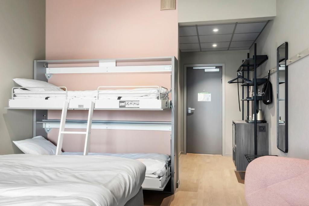 Postel nebo postele na pokoji v ubytování Aiden by Best Western Karlstad Arena