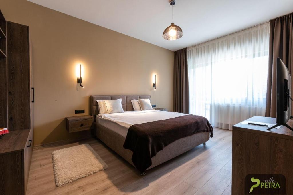 Кровать или кровати в номере Vila Petra