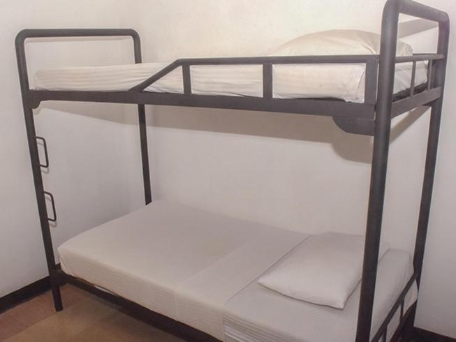 a couple of bunk beds in a room at MAS Athena in Ambepussa