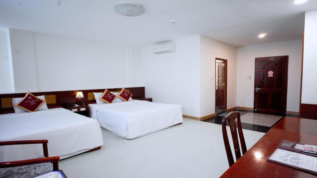 Postel nebo postele na pokoji v ubytování SÀI GÒN - BẠC LIÊU Hotel