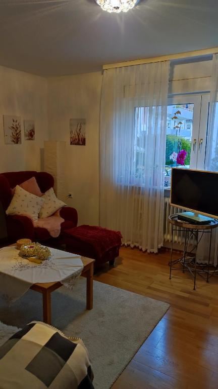 TV a/nebo společenská místnost v ubytování Ferienwohnung Sartorius