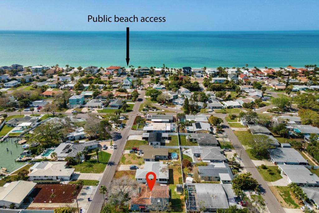 an aerial view of a residential neighborhood with the ocean at Relax with Family at the Beach! in St Pete Beach