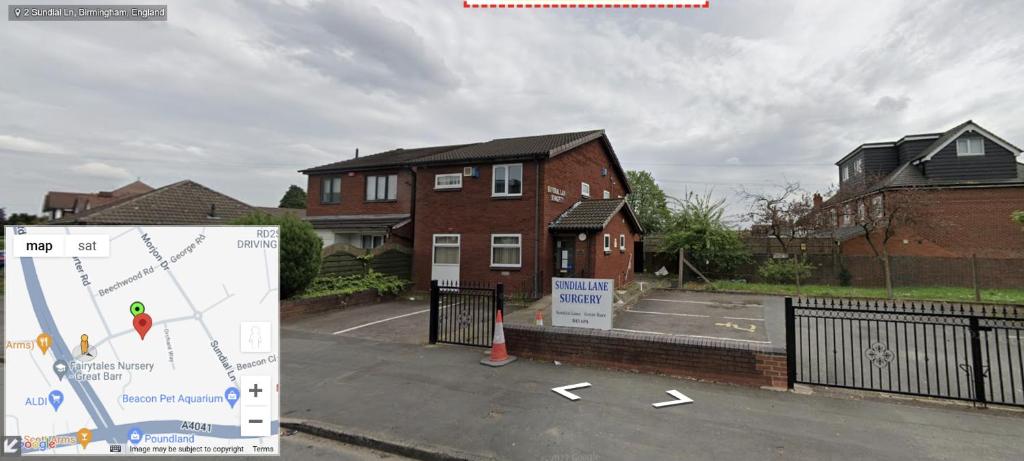 a building with a sign in front of a house at Private Ensuite Room next to A34 in Birmingham