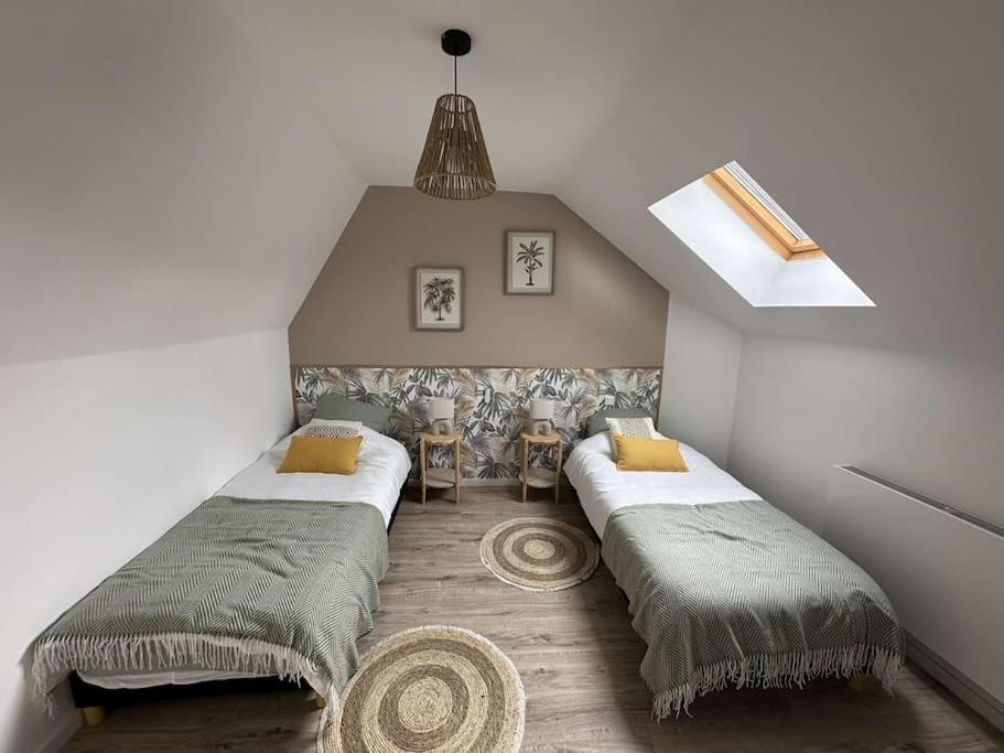 En eller flere senge i et værelse på Beau Séjour