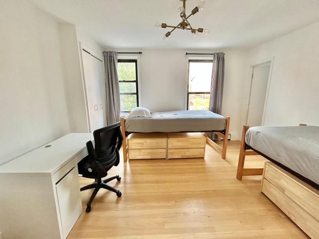 a bedroom with a bed and a desk and a desk at 232- 2B 2B Central Hoboken in Hoboken