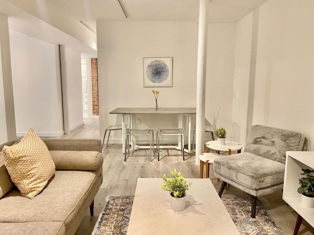 a living room with a couch and a table at 303-3Bedroom 2Bathroom in Hoboken