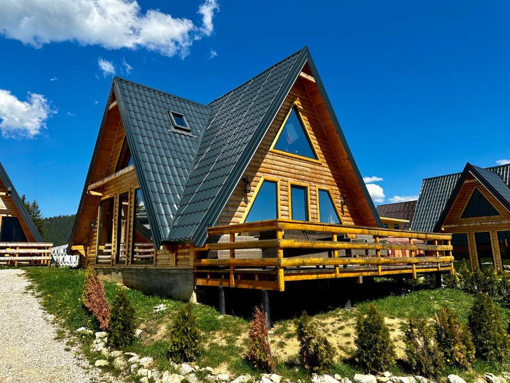 a large log cabin with a metal roof at AJLA in Vlasic