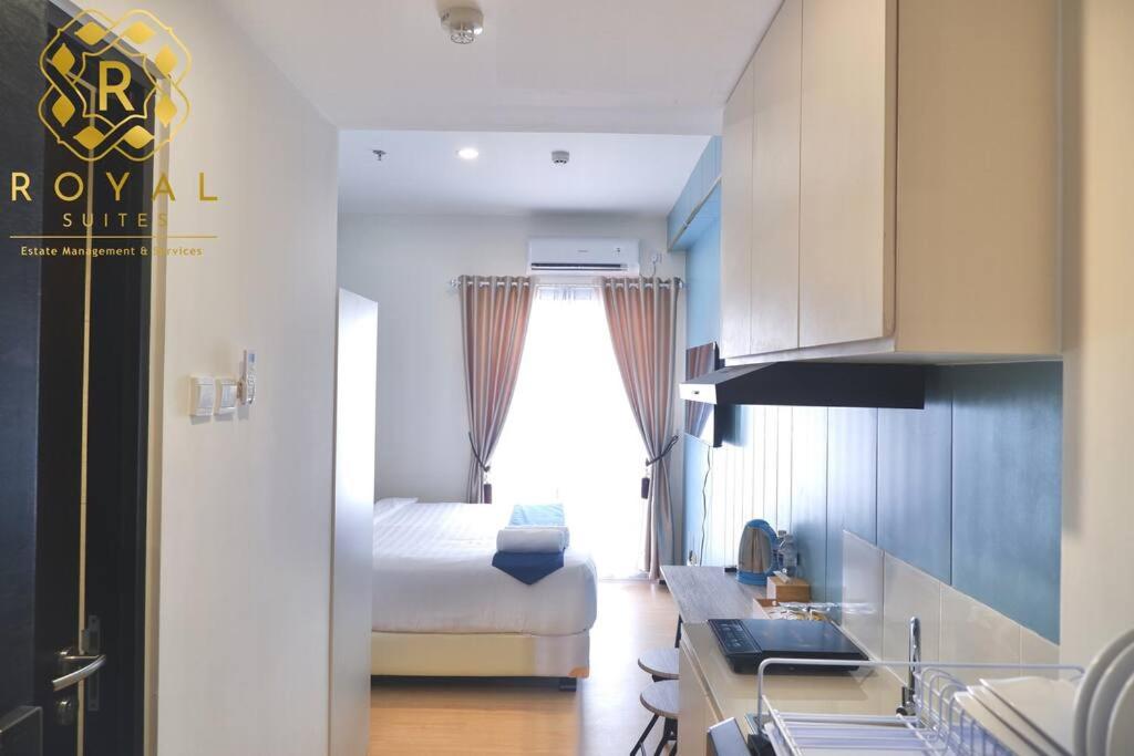 a kitchen with a bed and a sink in a room at Royal Suites Studio 18ZY - Citra Plaza Nagoya in Jodoh
