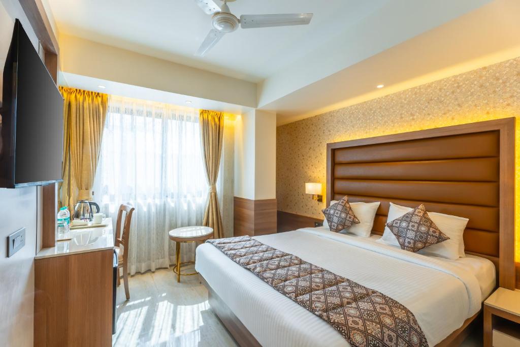 Postel nebo postele na pokoji v ubytování Hotel Supreme Comforts - Mumbai Airport