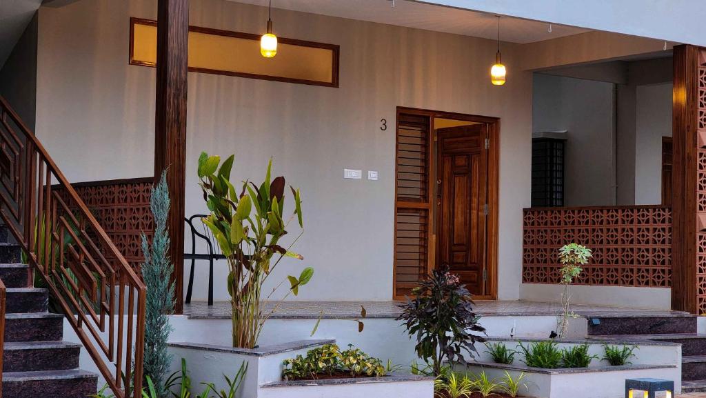 Zahrada ubytování Poojaris Nirantara - Mysuru
