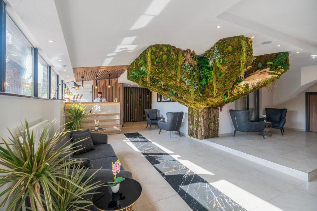 a lobby with a large heart sculpture in the center at MAGİA HOTEL in Istanbul