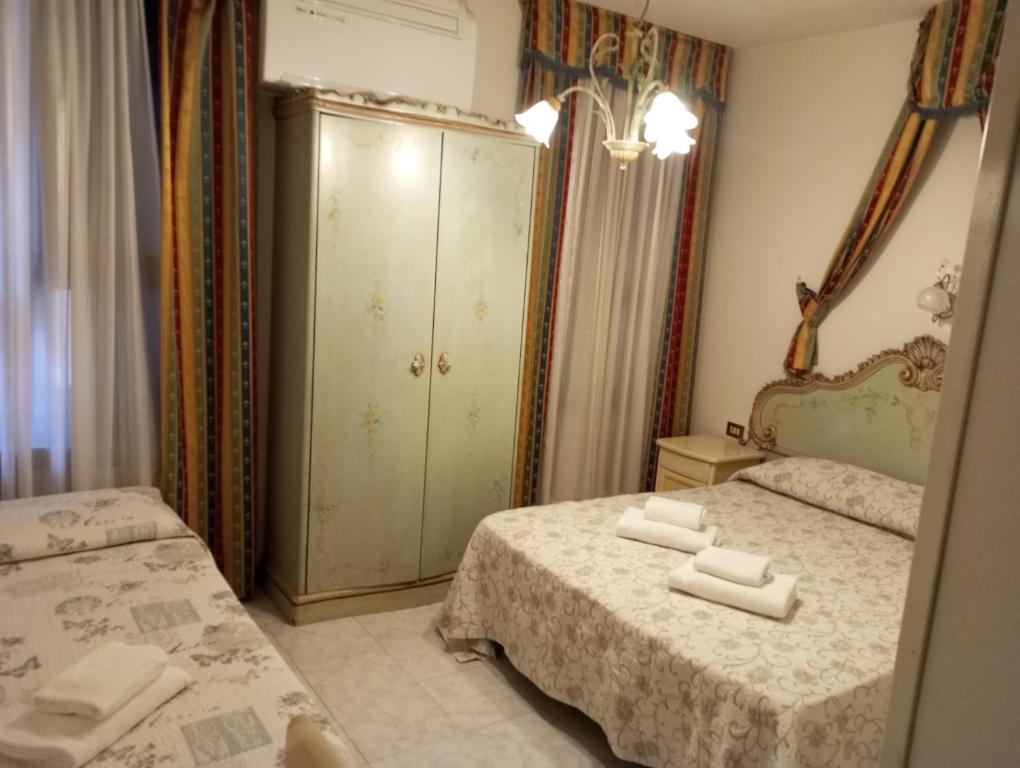 Postel nebo postele na pokoji v ubytování Hotel Henry