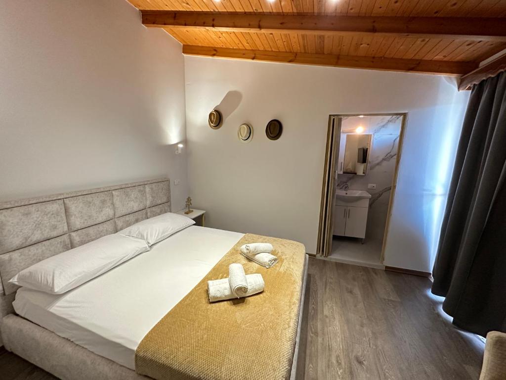 Postel nebo postele na pokoji v ubytování Anel Suites
