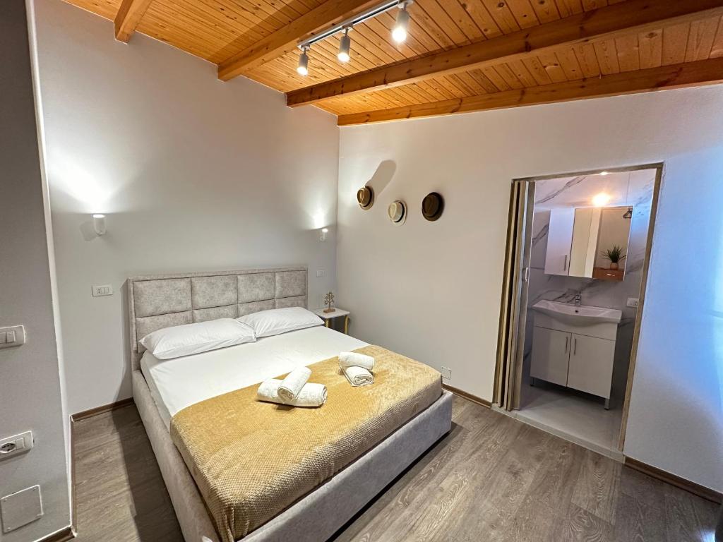Postel nebo postele na pokoji v ubytování Anel Suites