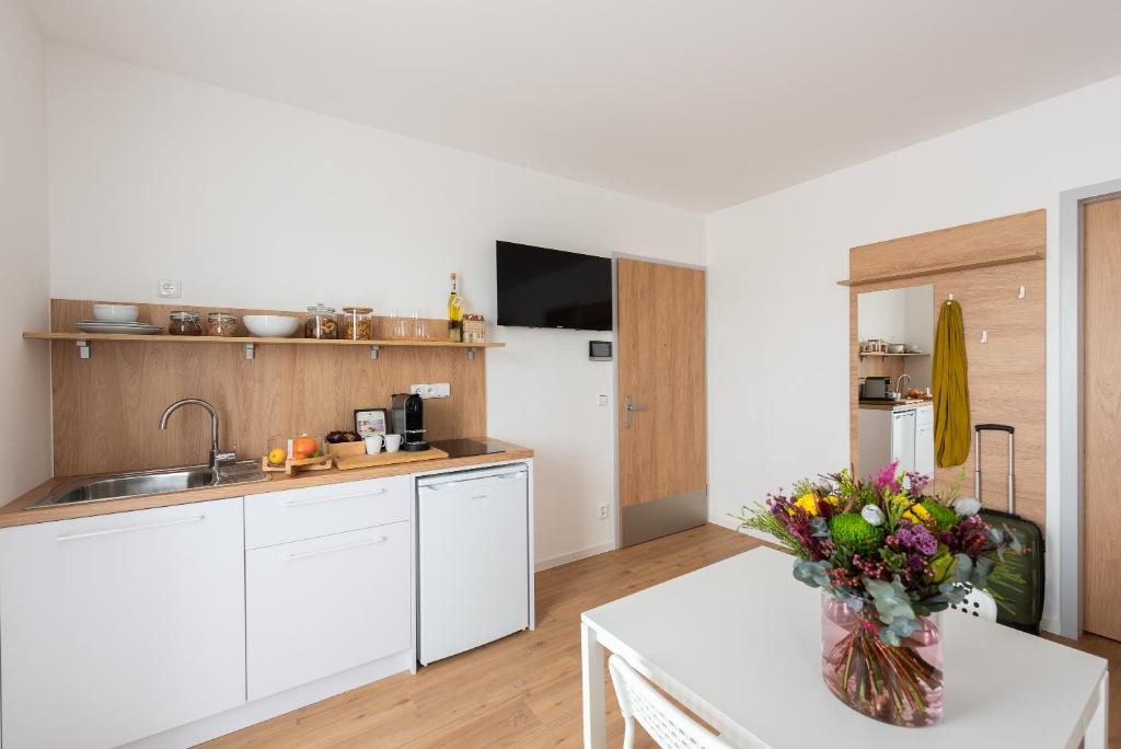 Kuchyň nebo kuchyňský kout v ubytování Libero Apartments