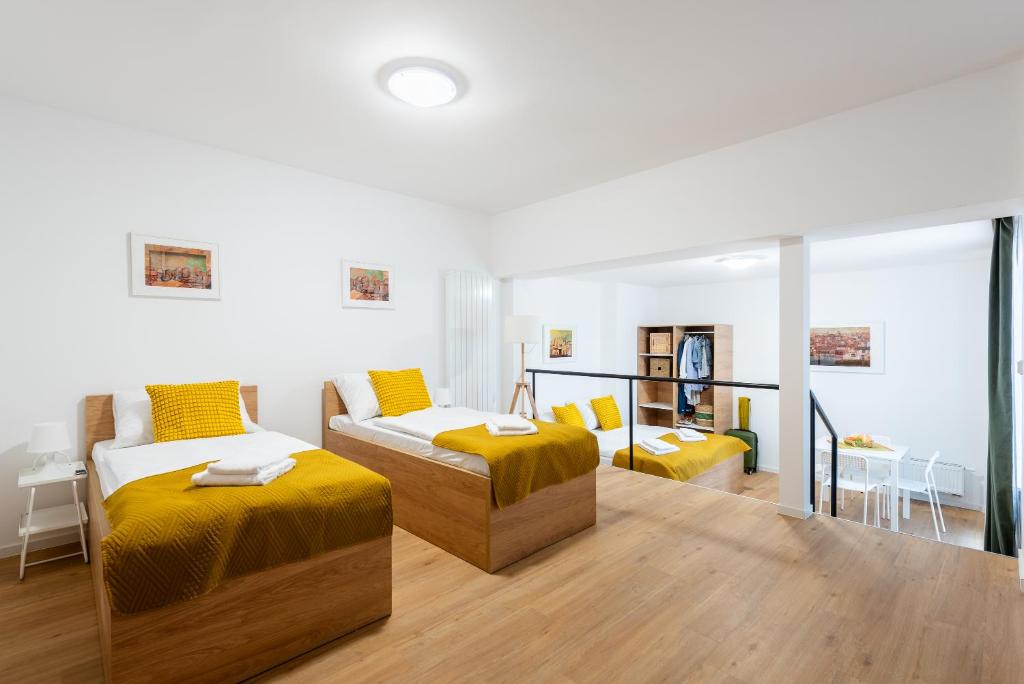 Postel nebo postele na pokoji v ubytování Libero Apartments