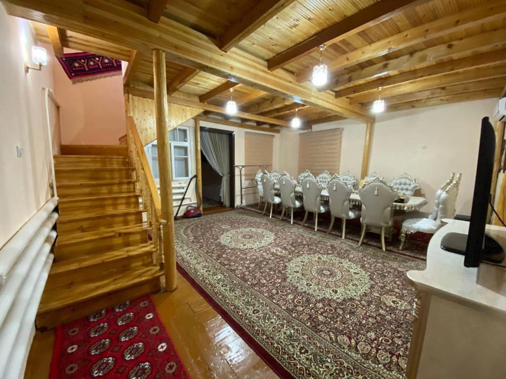 a room with a group of chairs and a table at Khan hotel in Khiva