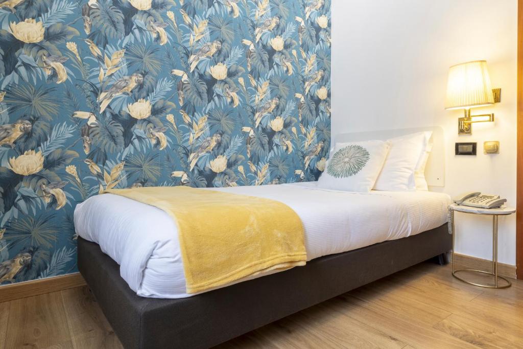 Postel nebo postele na pokoji v ubytování Hotel Bagliori