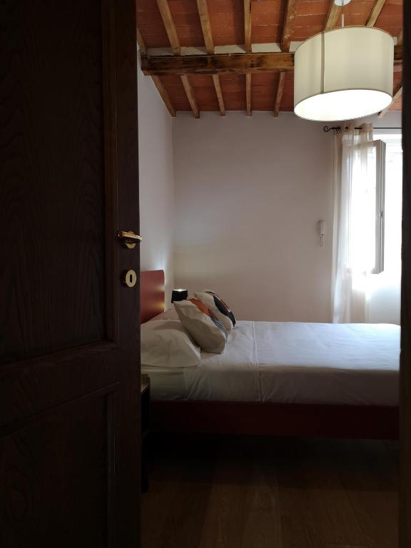 Postel nebo postele na pokoji v ubytování Borgo dei vigneti