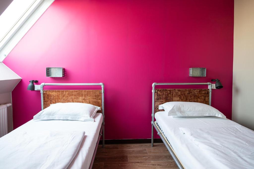 Postel nebo postele na pokoji v ubytování Wombat's City Hostel Vienna Naschmarkt