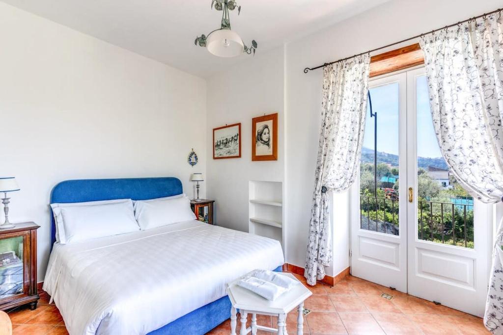 Posteľ alebo postele v izbe v ubytovaní Villa Lucia