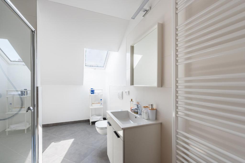 Koupelna v ubytování Libero Apartments
