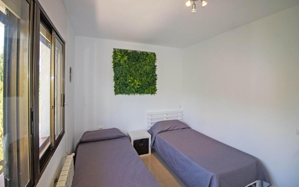 A bed or beds in a room at Villa con piscina privada y barbacoa - ALBERT VILLAS Alcossebre