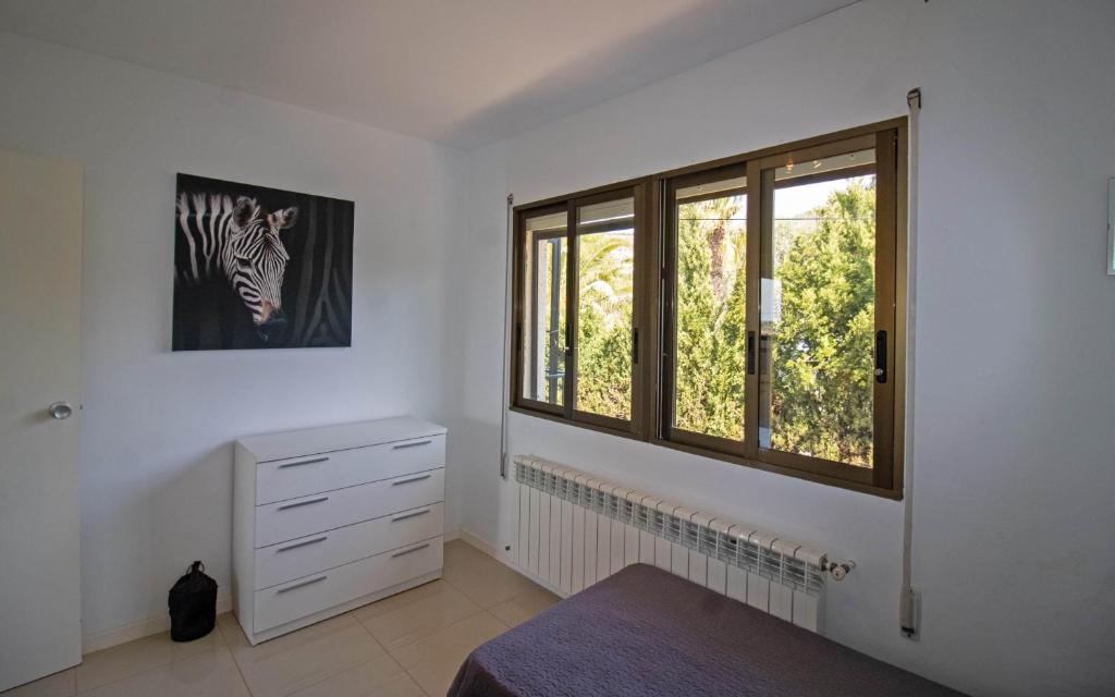 A bed or beds in a room at Villa con piscina privada y barbacoa - ALBERT VILLAS Alcossebre
