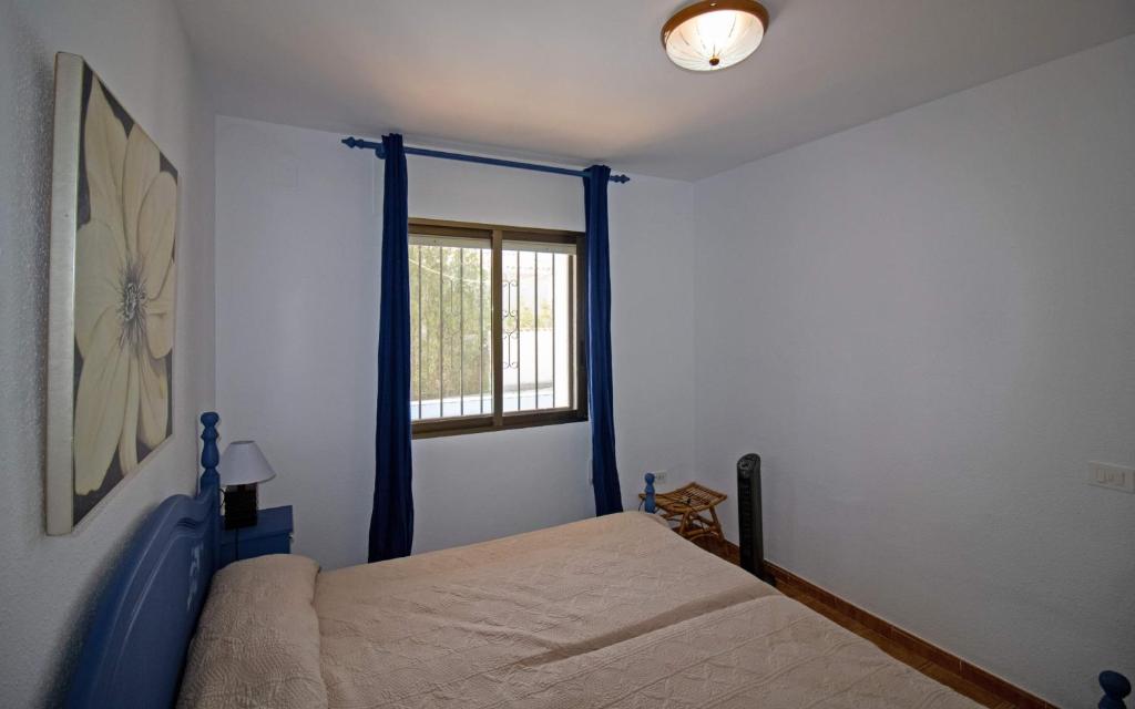A bed or beds in a room at Villa con piscina privada y barbacoa - ALBERT VILLAS Alcossebre