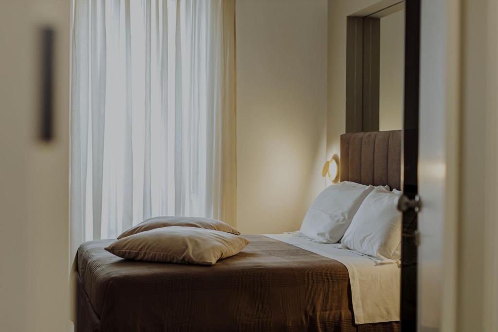 Postel nebo postele na pokoji v ubytování Le Grazie Relais & Spa