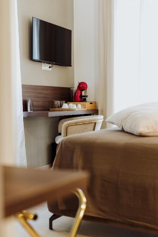 TV a/nebo společenská místnost v ubytování Le Grazie Relais & Spa