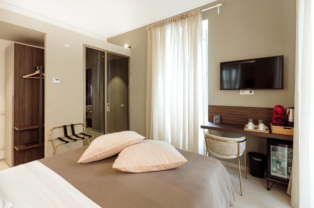 TV a/nebo společenská místnost v ubytování Le Grazie Relais & Spa