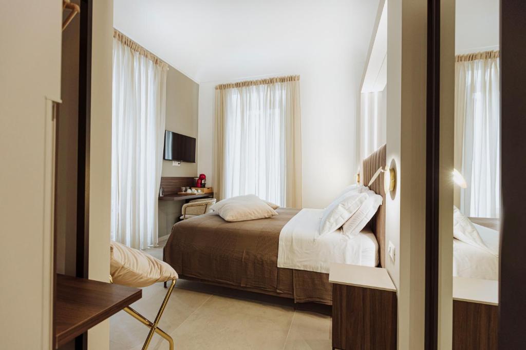 Postel nebo postele na pokoji v ubytování Le Grazie Relais & Spa
