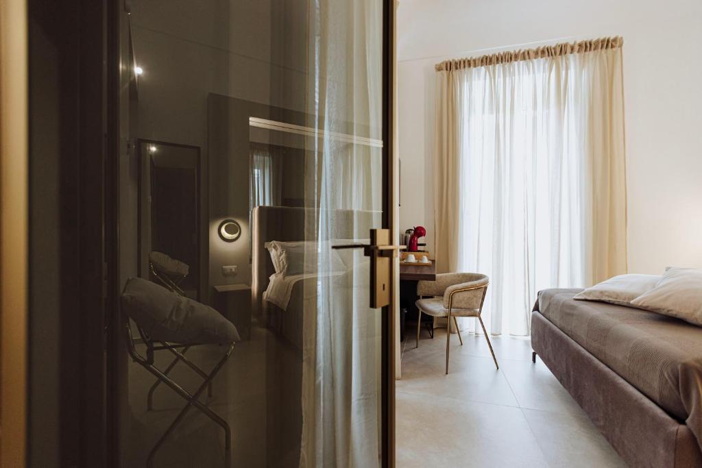 Postel nebo postele na pokoji v ubytování Le Grazie Relais & Spa