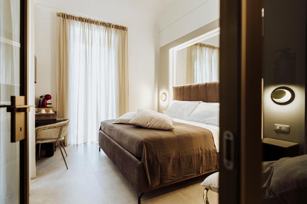 Postel nebo postele na pokoji v ubytování Le Grazie Relais & Spa