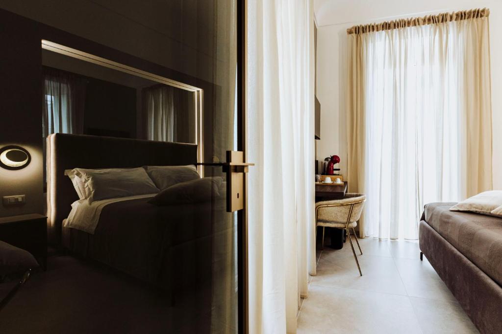 Postel nebo postele na pokoji v ubytování Le Grazie Relais & Spa