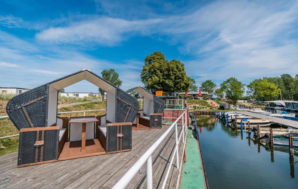 a house on a dock next to a canal at Apartments Waterfront in Sagard
