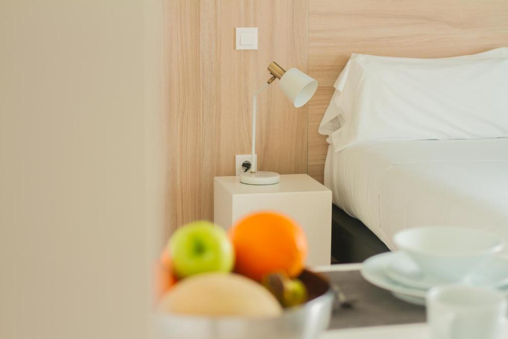 Postel nebo postele na pokoji v ubytování room Select Porto Suites