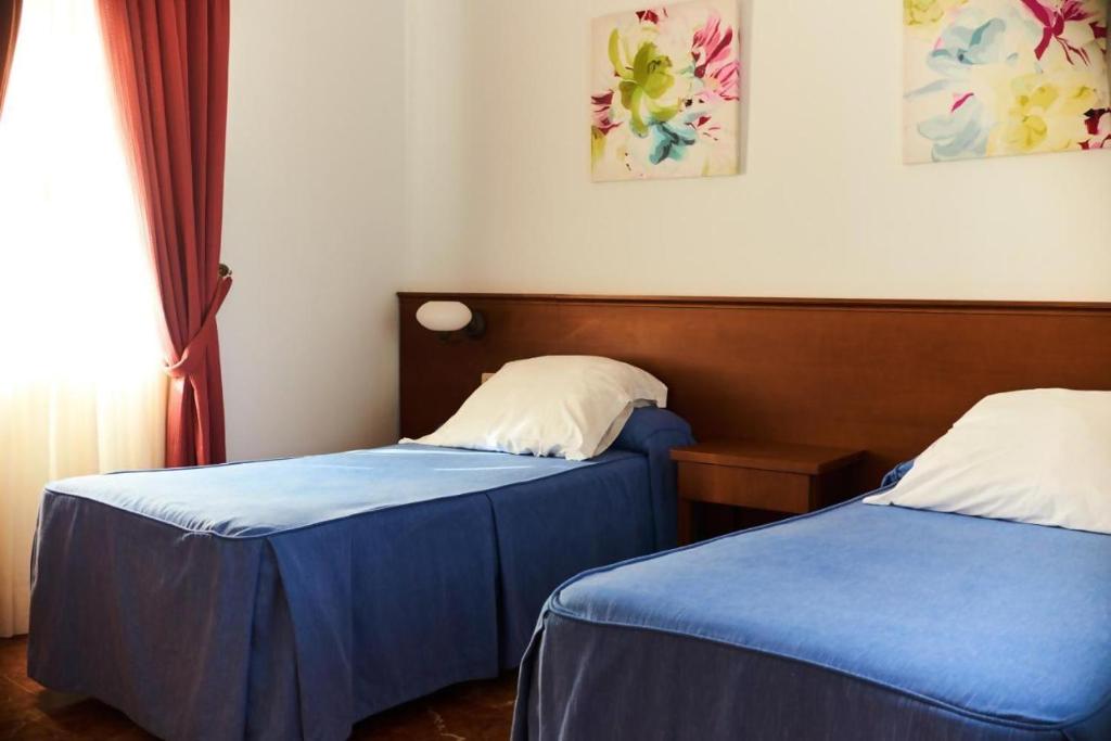 Postel nebo postele na pokoji v ubytování Apartamentos San Andres