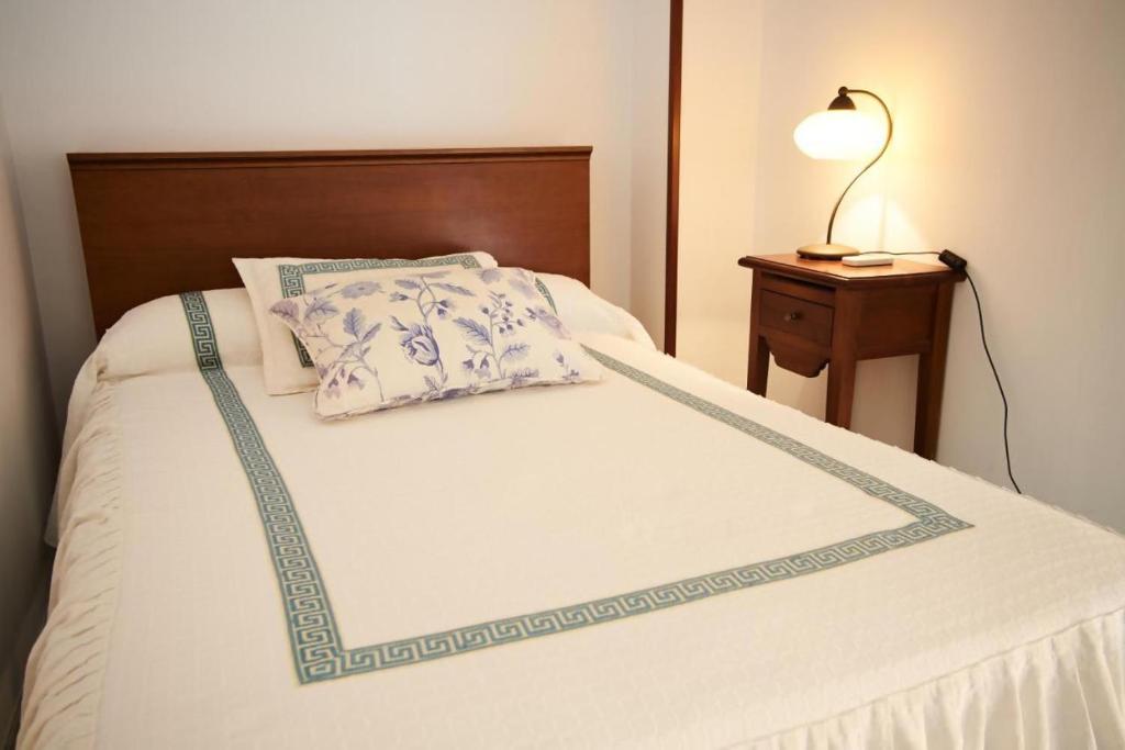 Postel nebo postele na pokoji v ubytování Apartamentos San Andres
