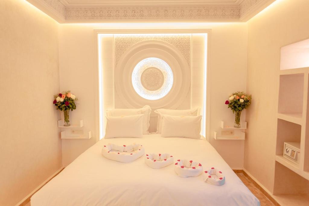 Postel nebo postele na pokoji v ubytování Luxe Nomade Marrakech & Spa