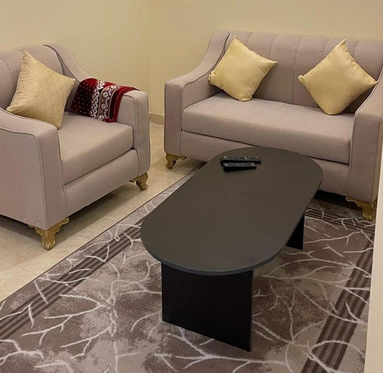 a living room with a couch and a table at شقق العاصفه4 in Khamis Mushayt