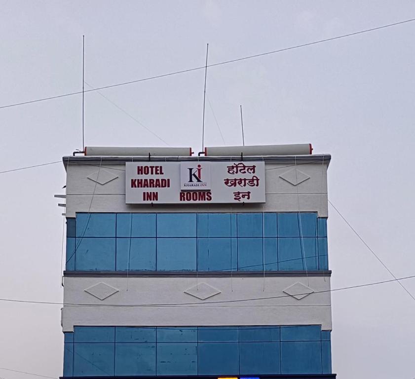 a building with a sign on top of it at Hotel Kharadi Inn in Pune