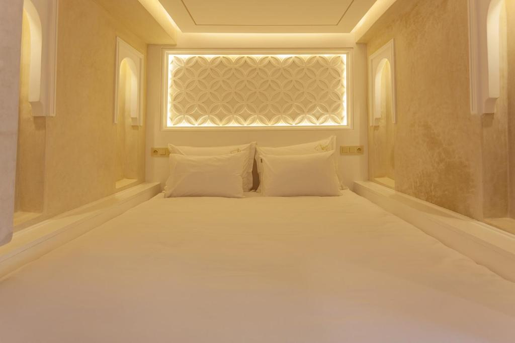 Postel nebo postele na pokoji v ubytování Luxe Nomade Marrakech & Spa
