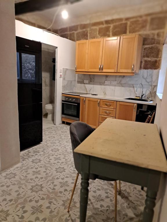 Kuchyň nebo kuchyňský kout v ubytování Ta' Marta Lodge