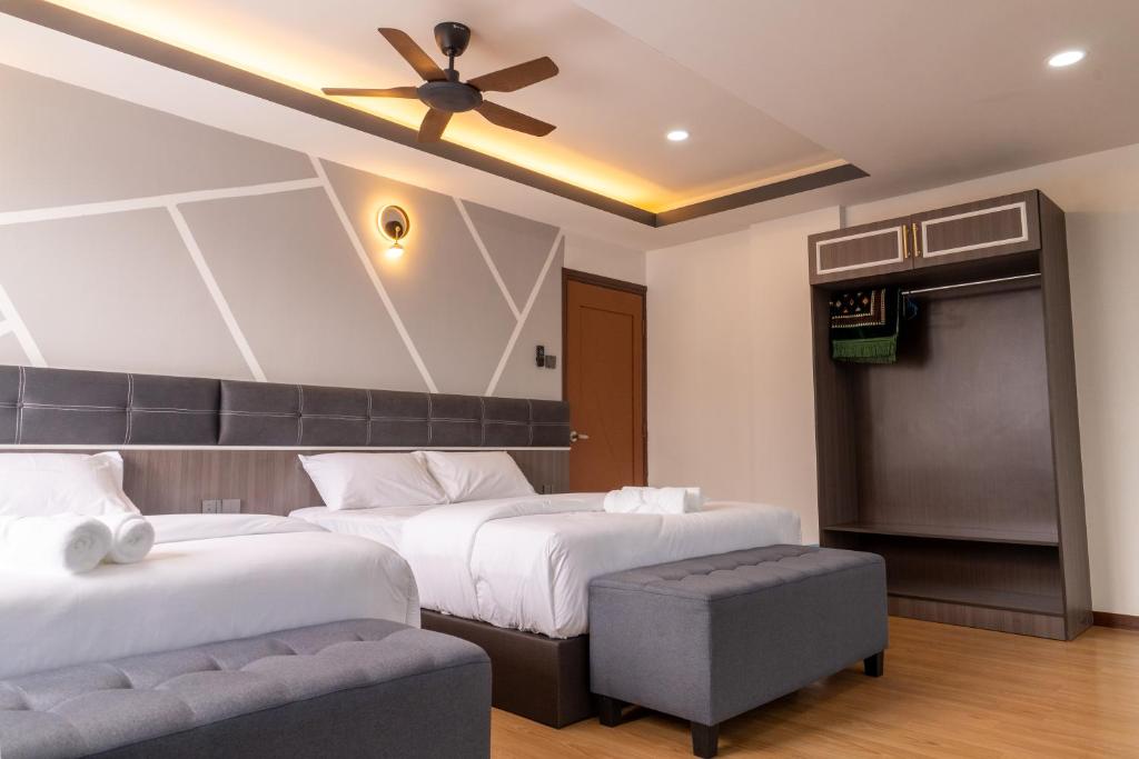 Rúm í herbergi á Sunrisestay
