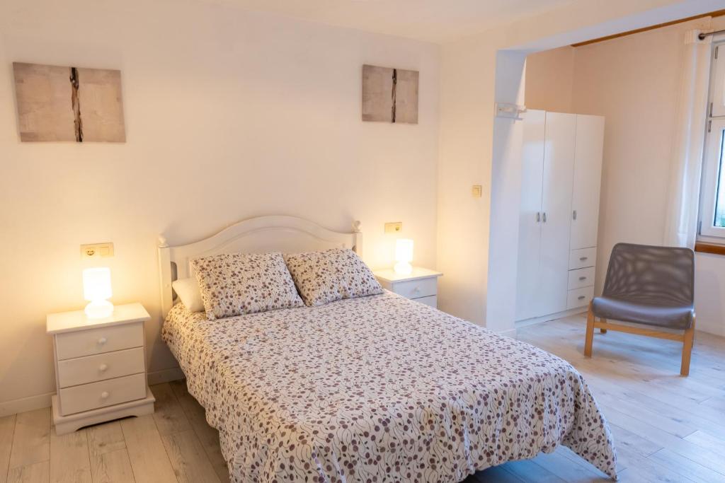 Postel nebo postele na pokoji v ubytování APARTAMENTOS OLGA