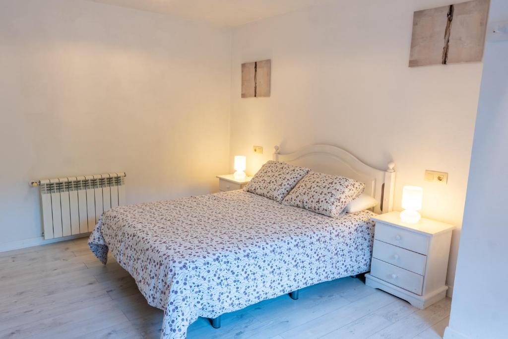 Postel nebo postele na pokoji v ubytování APARTAMENTOS OLGA